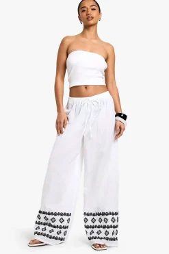 Petite Wide Leg Broderie Hem Trouser | Nasty Gal